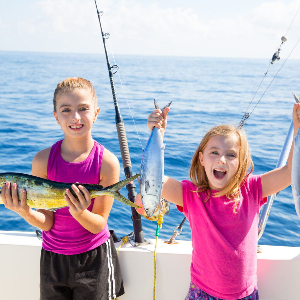 Happy tuna fisherwomen kid girls with fishes