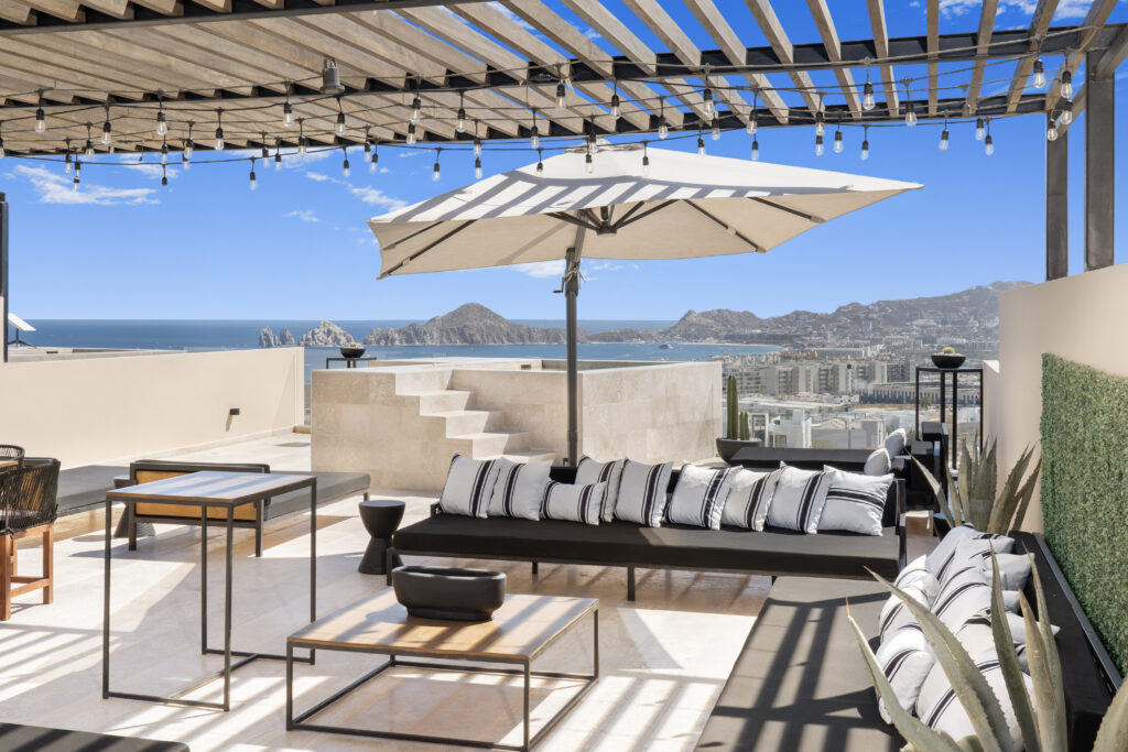 Rooftop lounge seating with Cabo Arch view at Mistiq Views Cabo